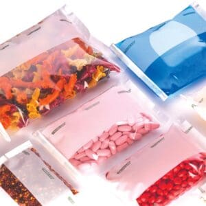 Various colorful pills and capsules in transparent resealable bags.
